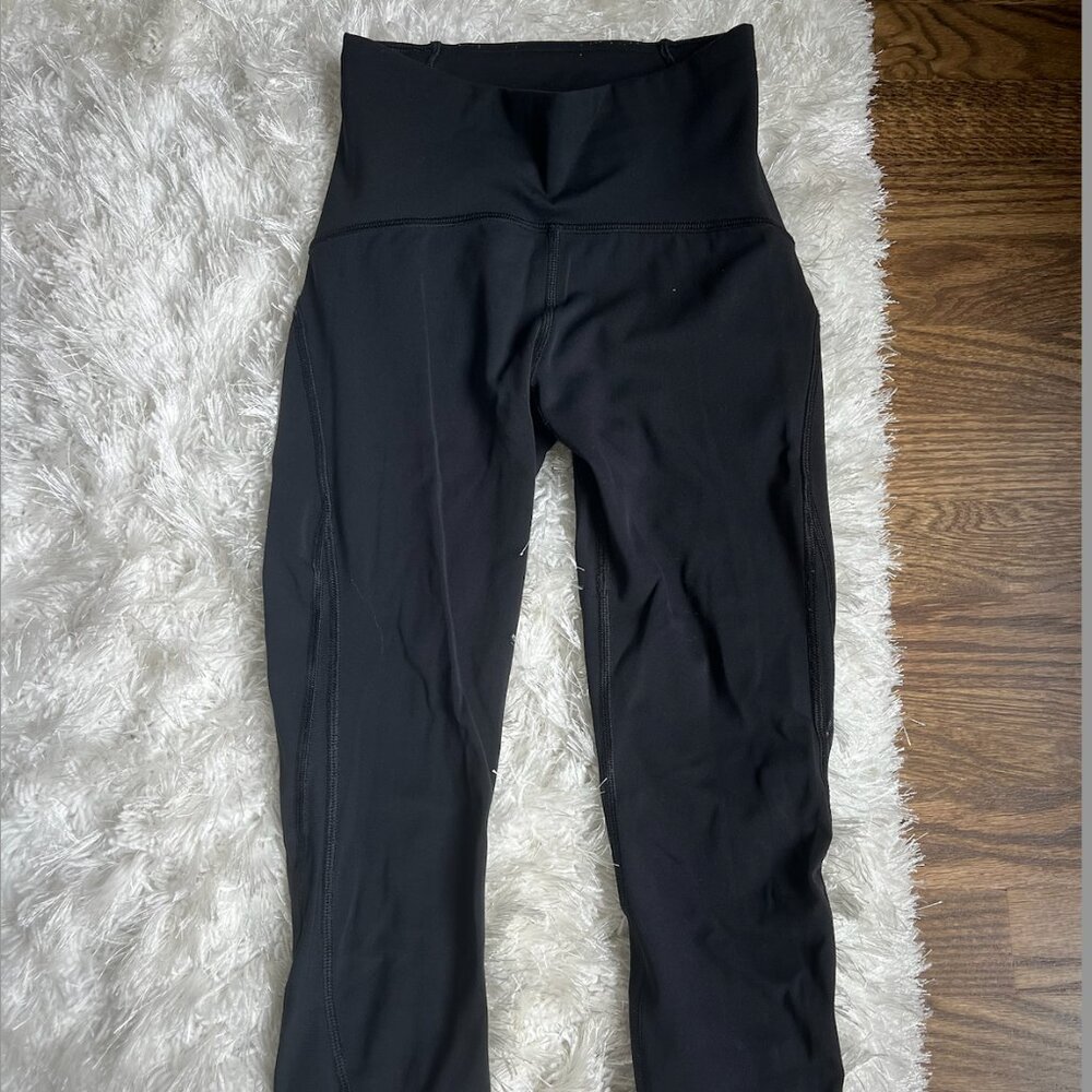 Lululemon crop black leggings with mess on side